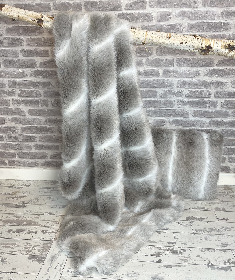 Reindeer faux fur throw with matching cushion