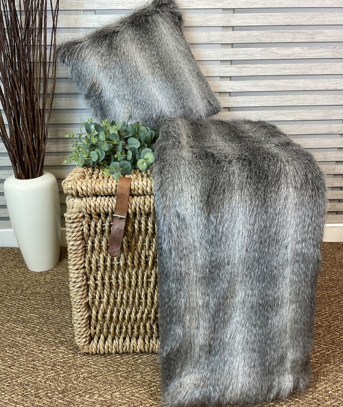 Grey striped fur blanket with matching cushion