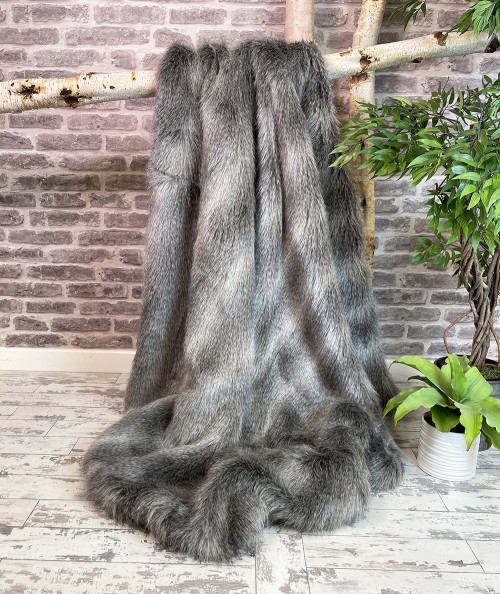 Long haired grey striped faux fur bedspread