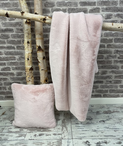 Large pink faux fur bedspread with pink faux fur cushion