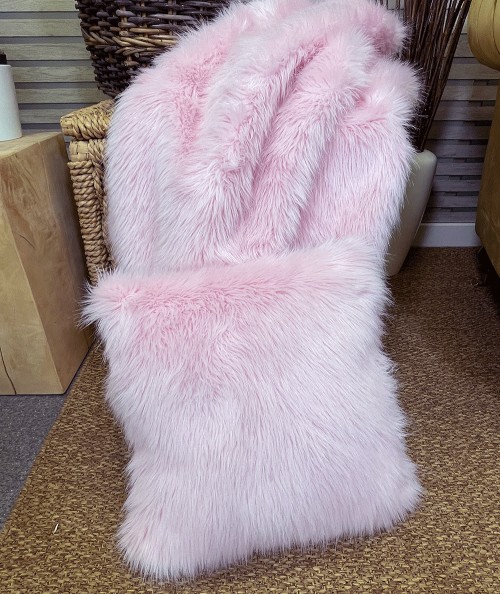 Pale pink faux fur bedspread