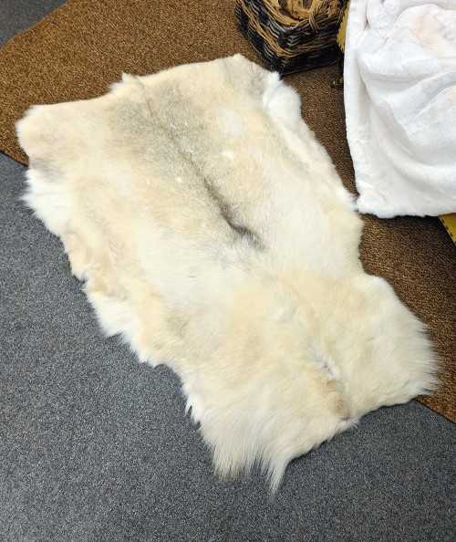 Pale coloured caribou skin rug