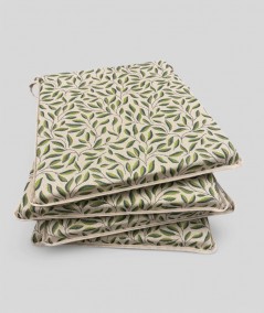 Natural linen seat pads with a modern green leaves design