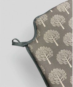 Thick, warm grey coloured chair pads with a modern tree design in cream