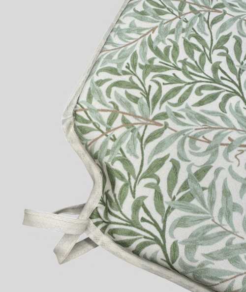 Patterned spindle chair pads in light green