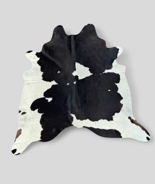 X/Large Black and off-white Cowhide Rug