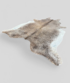 Enormous brown and white natural cowhide rug