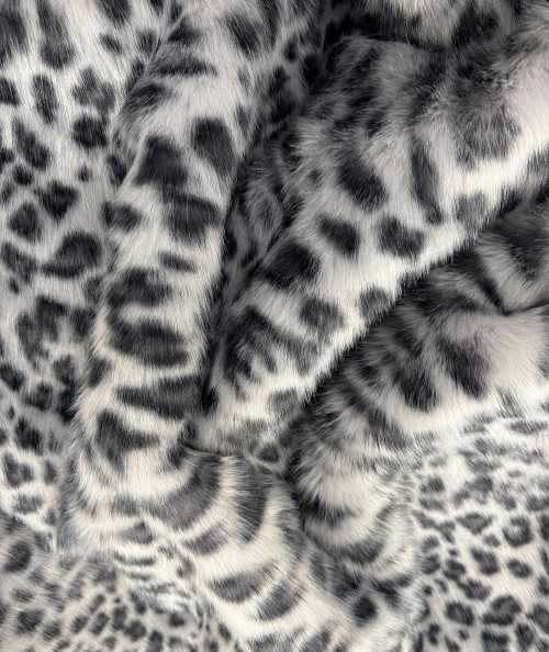 Close up image of the animal print faux fur fabric